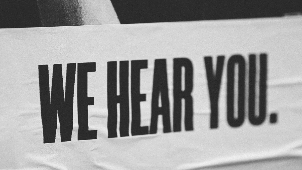 A picture of a banner that reads ‘we hear you’. GL Homes is committed to receiving feedback from their clients and resolving any issues that arise..